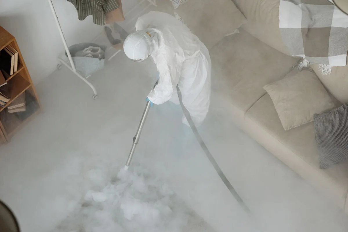 Biohazard cleanup technician in protective equipment, Nettleton, MS